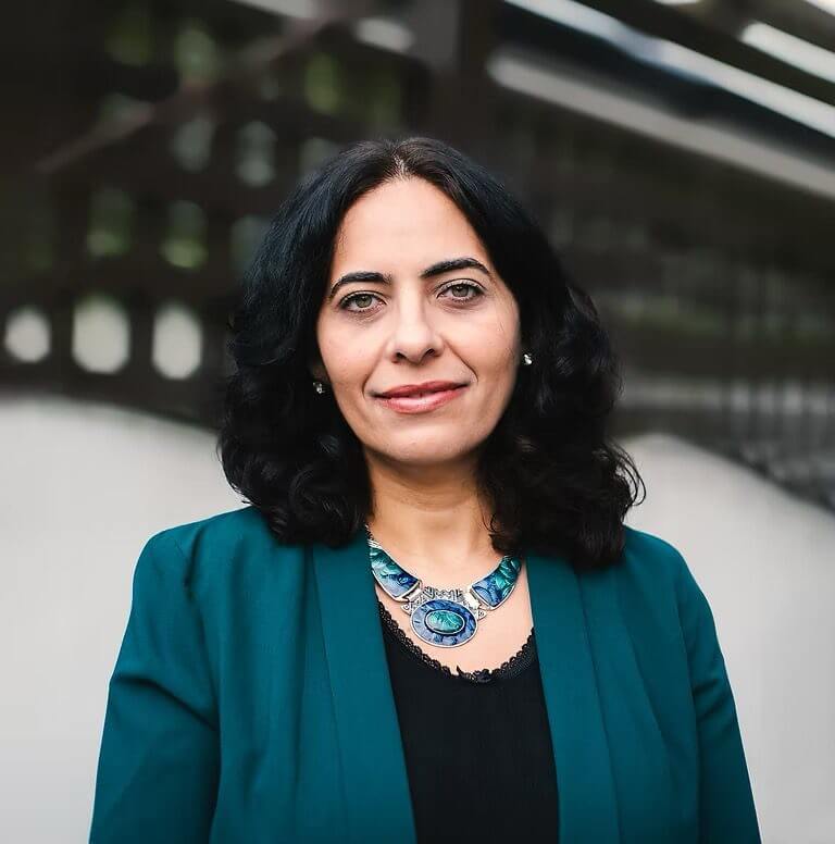 Culturally informed therapist Dr. Fevronia Christodoulidi smiling outdoors