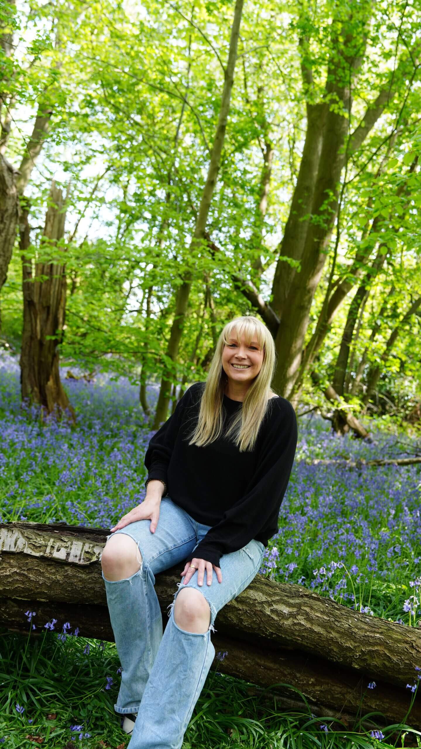 Why Summer Can Feel So Hard When You’re Recovering From an Eating Disorder Becky Stone, eating disorder therapist, sitting outdoors in nature during summer, smiling calmly
