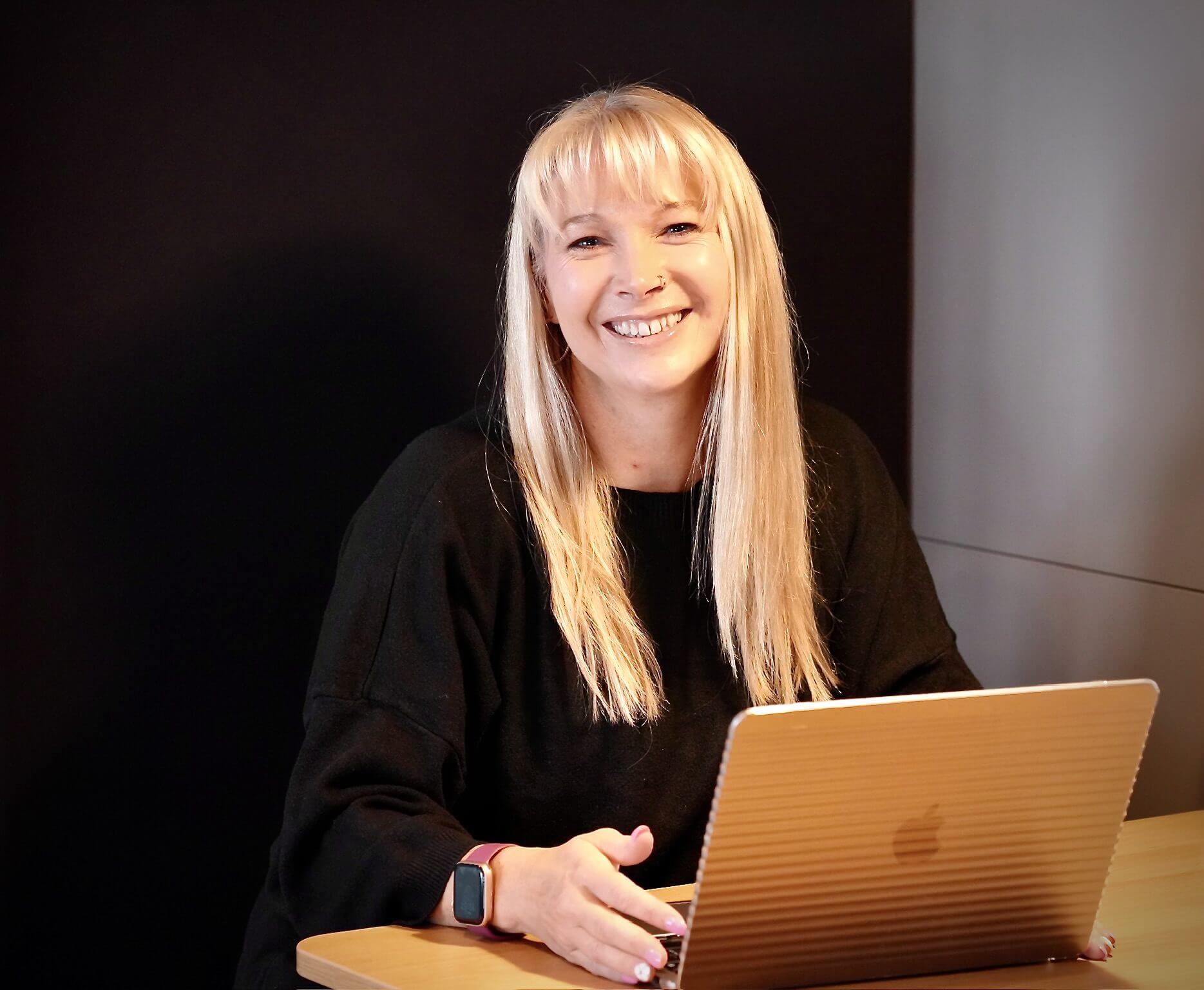 Becky Stone, a neurodivergent therapist based in Canterbury, working on her ADHD and social anxiety blog content for clients seeking trauma-informed therapy
