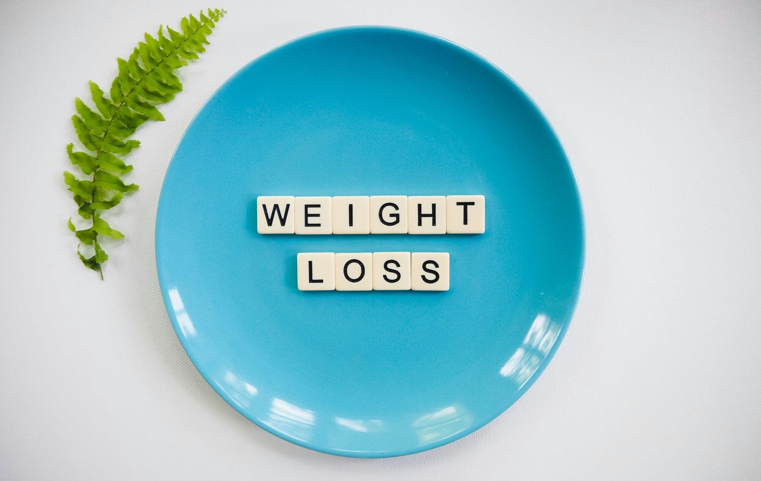 Weight Loss Messaging – Ozempic and Eating Disorders Blog Weight loss messaging shown on a plate, representing diet culture pressure and the risks of relying on Ozempic and quick fixes instead of trauma-informed eating disorder therapy in Canterbury