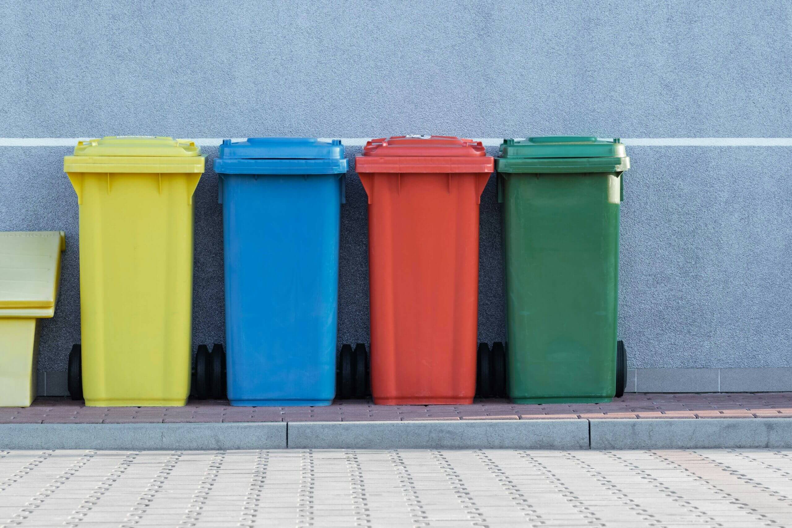 Trusting Your Gut – Therapy Journey in Canterbury Colourful recycling bins representing choices, intuition, and personal growth, linked to trusting your gut in therapy and mental health support in Canterbury