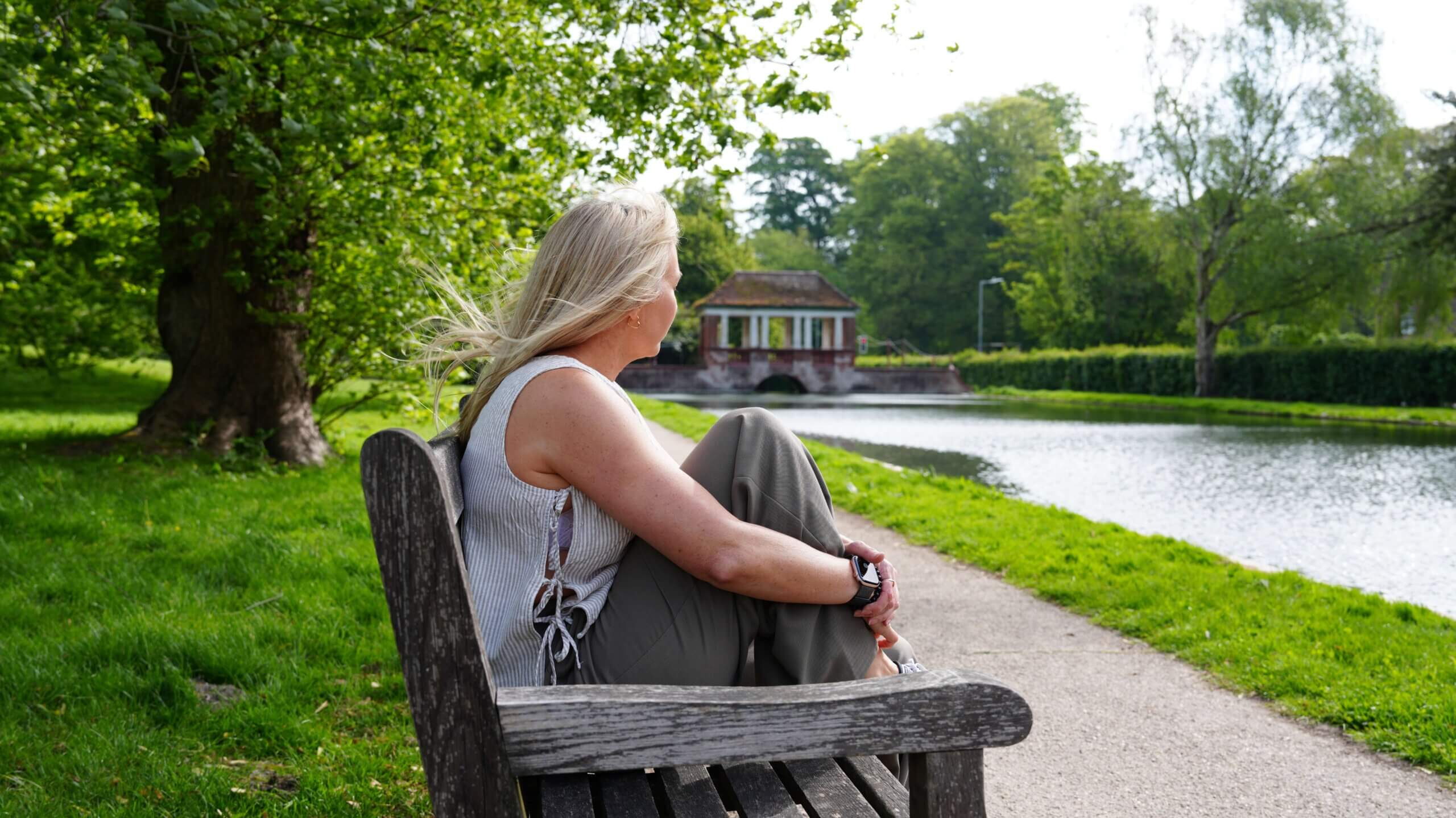 ADHD, Anxiety & Overthinking Support | Becky Stone Counsellor Canterbury Woman sitting alone outdoors experiencing emotional overwhelm, anxiety, ADHD overthinking, and nervous system exhaustion.