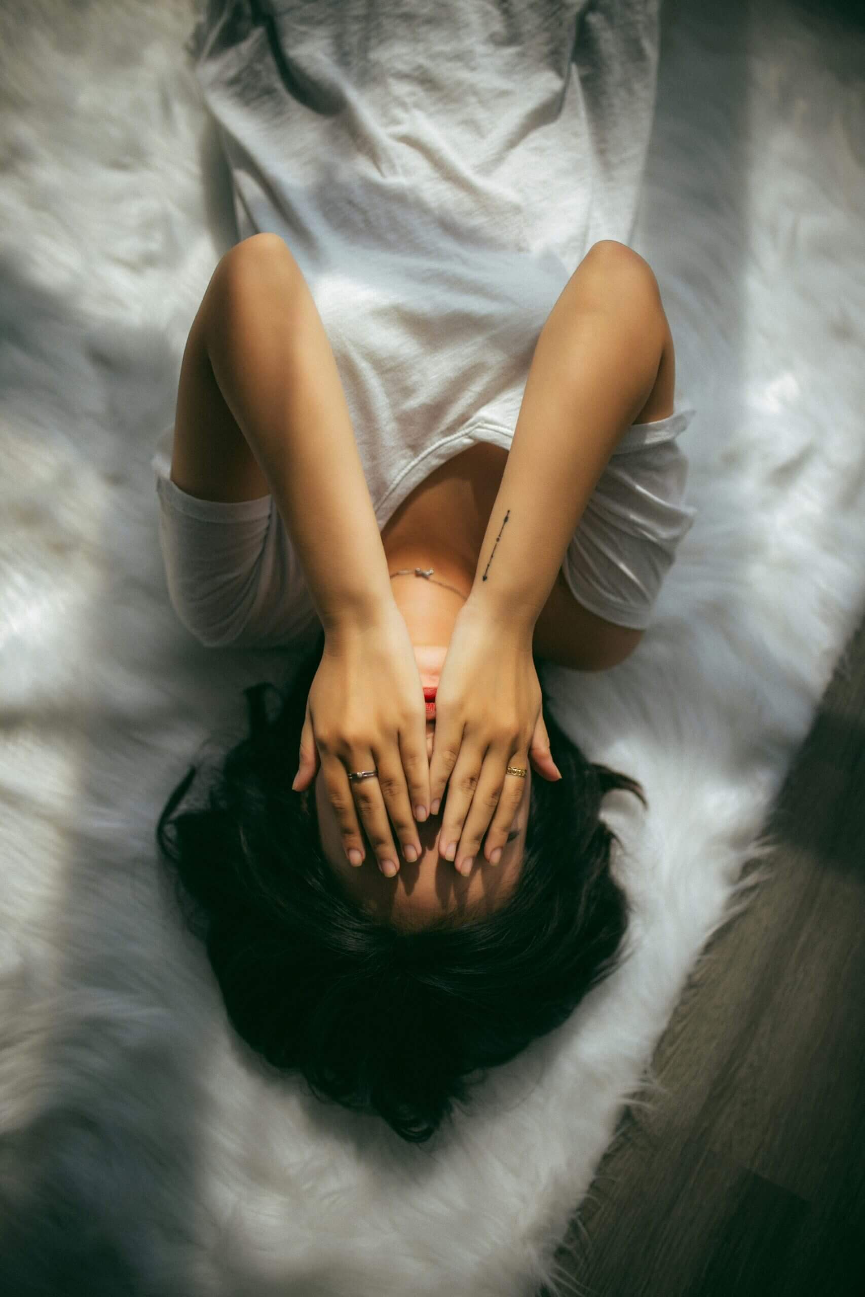 ADHD and Gaslighting in Relationships – Emotional Overwhelm and Self-Doubt Person covering their face in water representing emotional overwhelm, confusion, and self-doubt linked to ADHD and gaslighting in relationships.