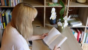 Becky Stone, binge eating disorder therapist reviewing client resources in her counselling practice