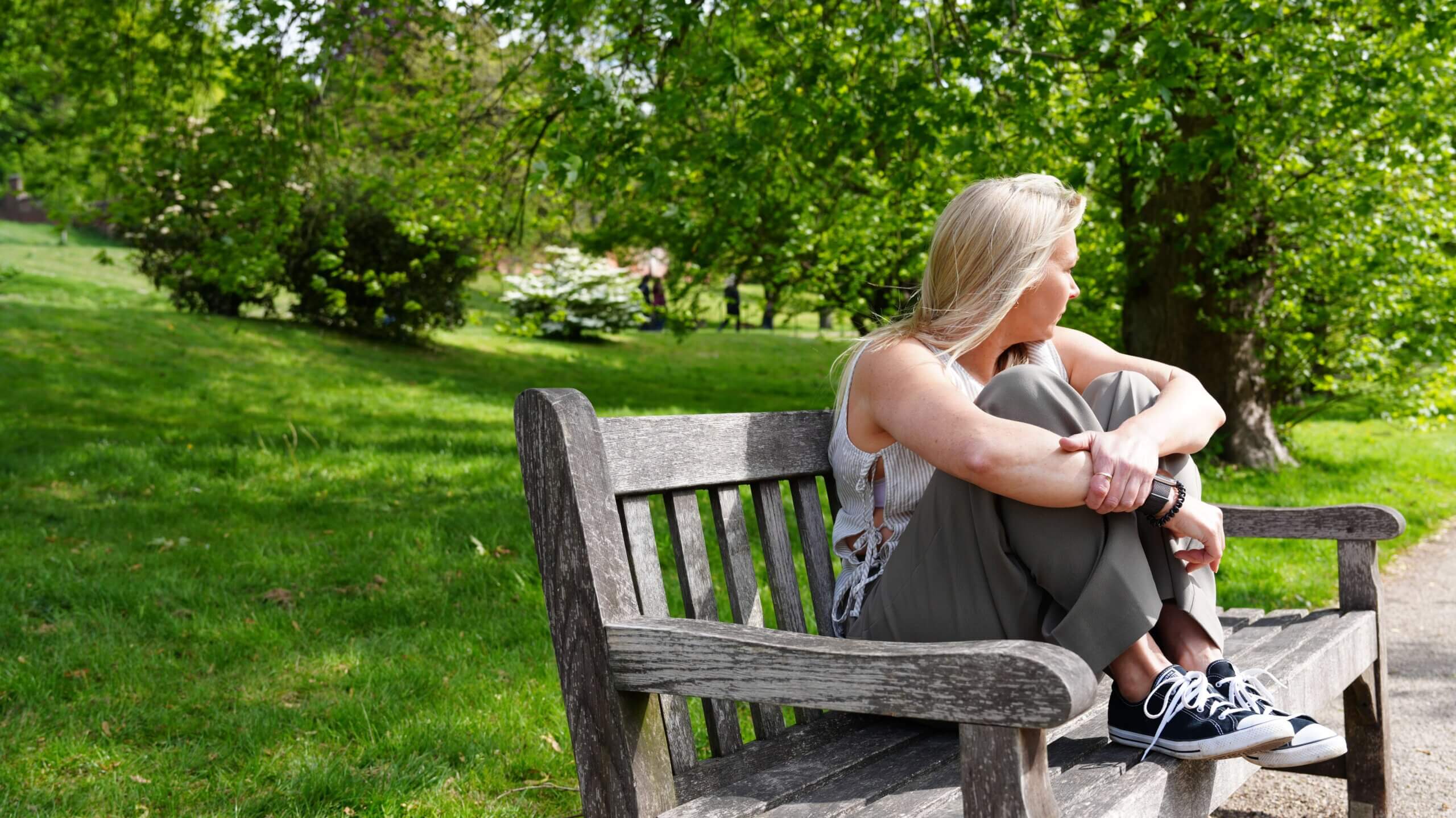 Becky Stone – Eating Disorder Counsellor Becky Stone, eating disorder counsellor, sitting on a bench in a garden